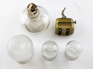 Set of Three blown glass cupping Glasses with Alcohol Lamp and Twelve Blade Scarificator.