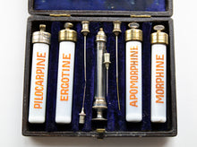 Load image into Gallery viewer, Early Syringe with needles and four ceramic vials with brass caps and labeled
