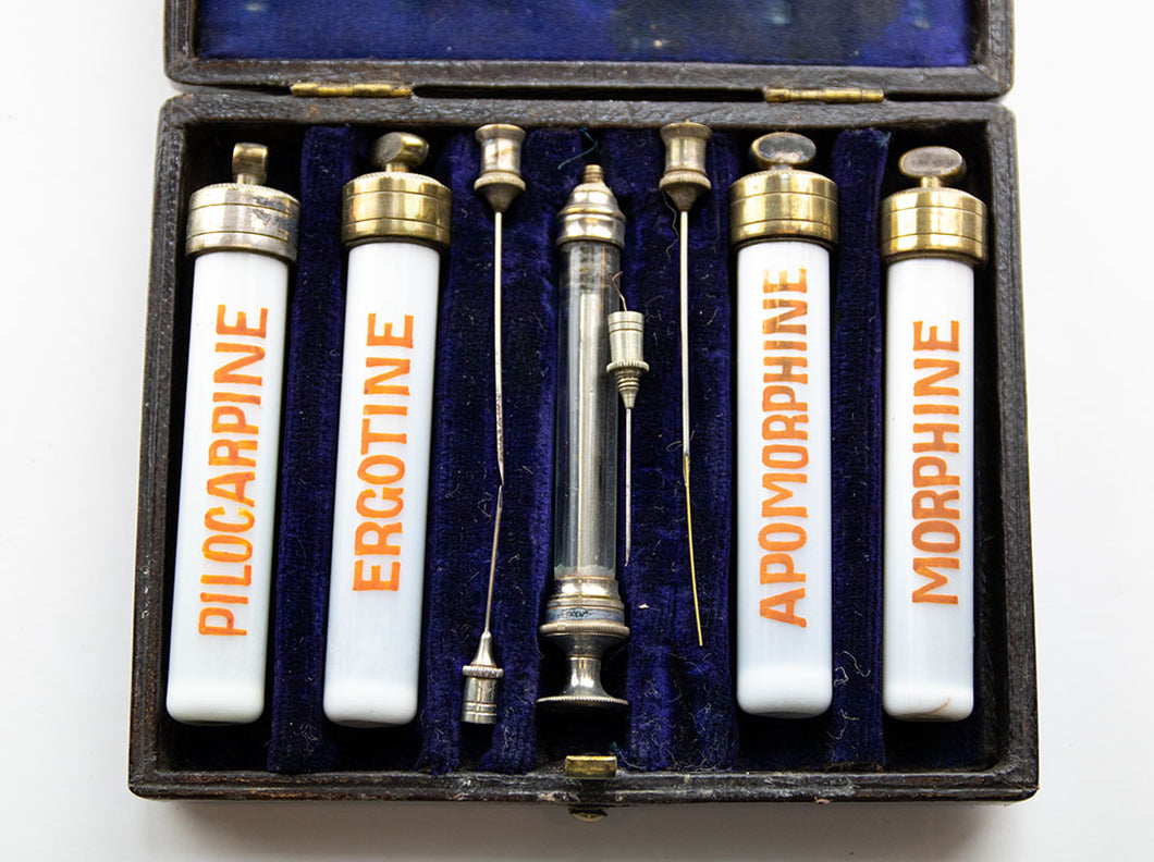 Early Syringe with needles and four ceramic vials with brass caps and labeled